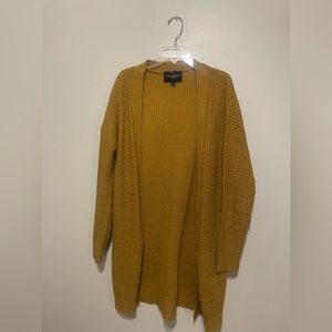 yellow cardigan